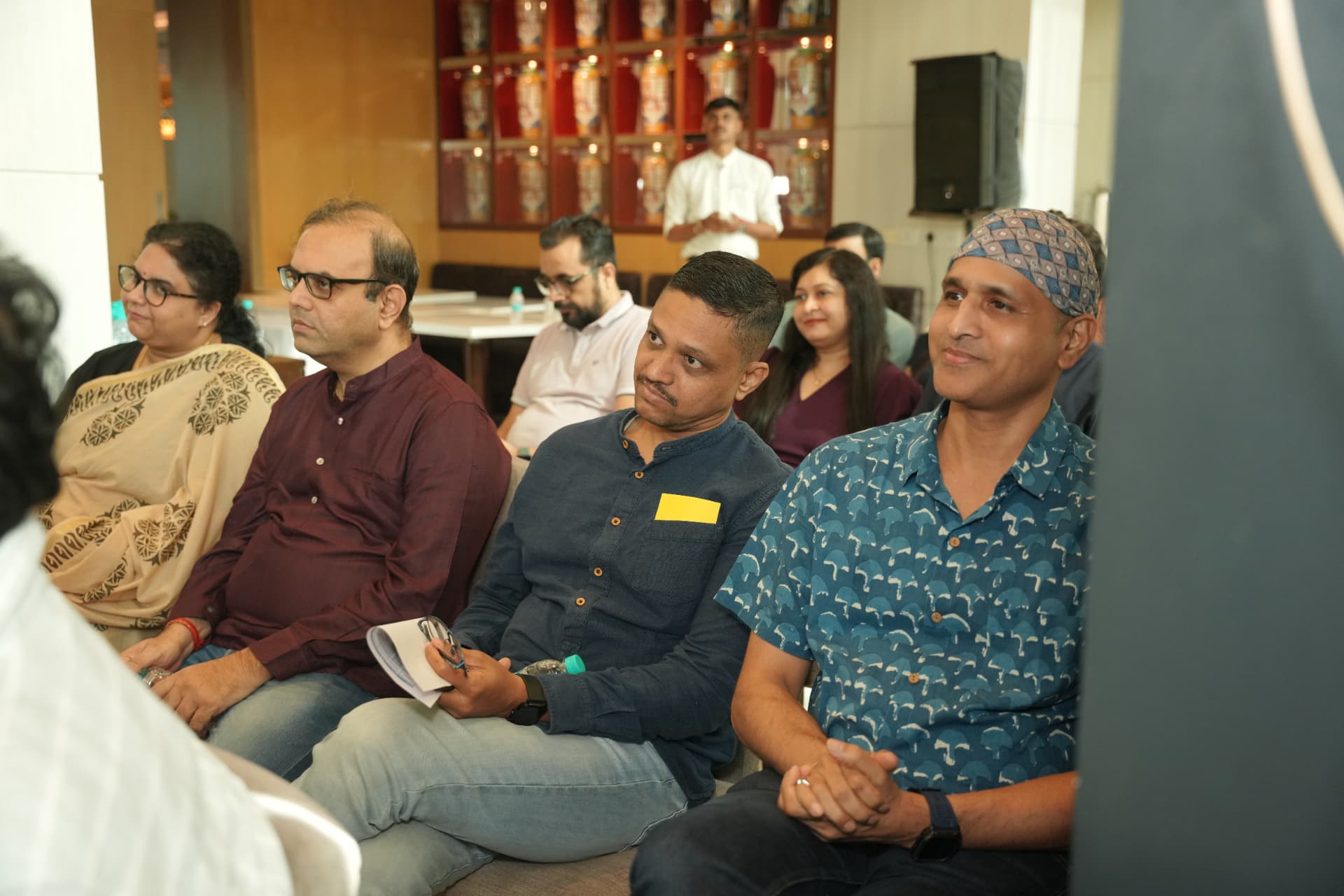 The audience immersed in the evening's talks.