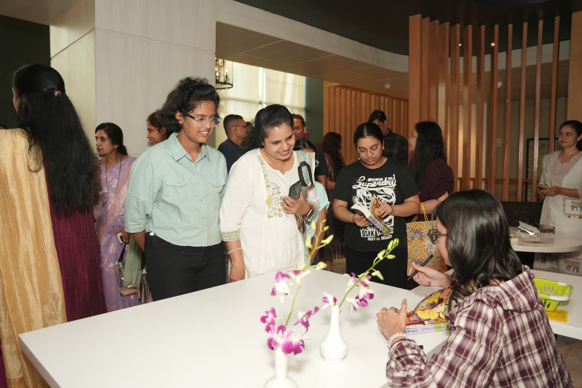 Signing books for friends and well-wishers.